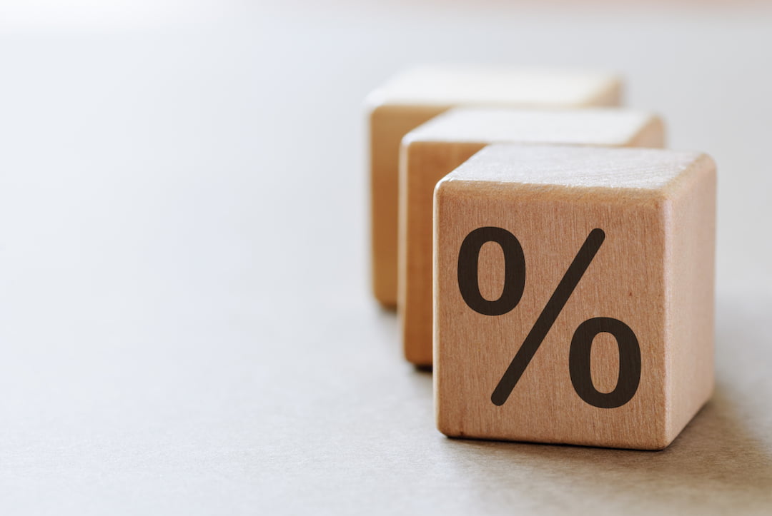 Wooden dice with percentage symbol |Featured Image For Cash Rate Remains at Historic Low - April 2018 blog